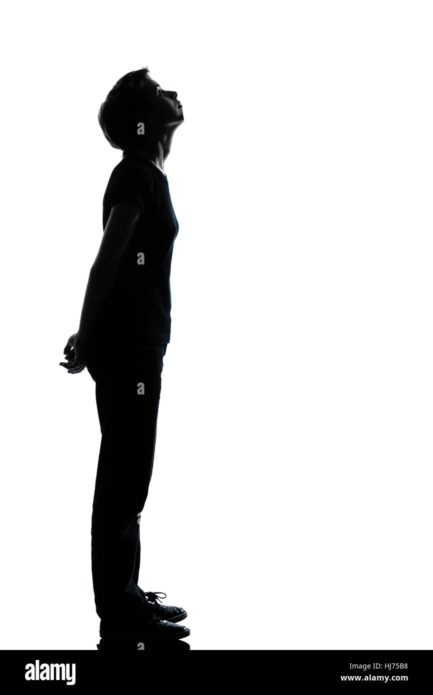 eine kaukasische junger Teenager Silhouette junge oder Mädchen voller Länge im Studio isoliert auf weißem Hintergrund ausschneiden Stockfoto