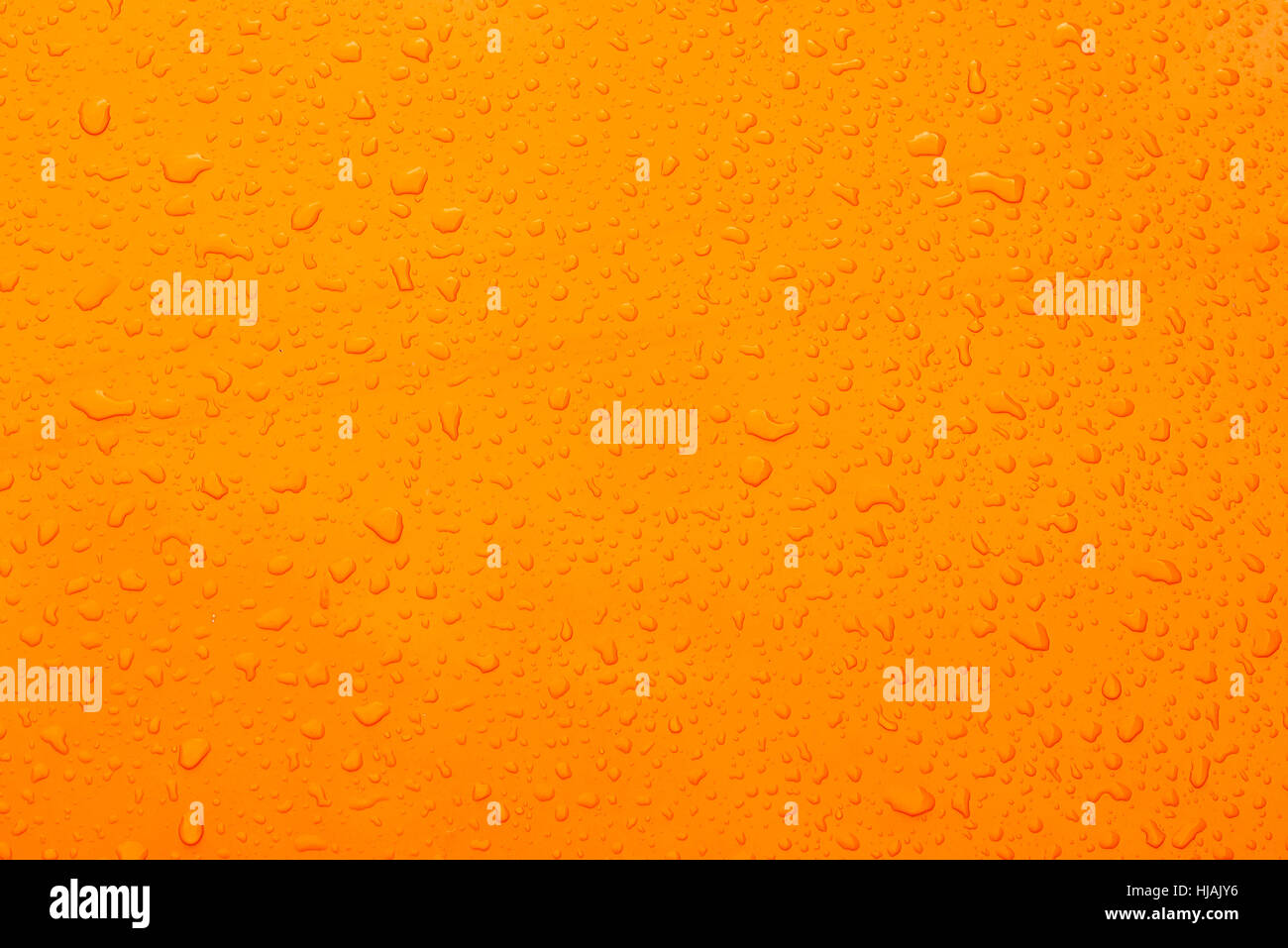 Wasser Tropfen orange collor Hintergrund Stockfoto