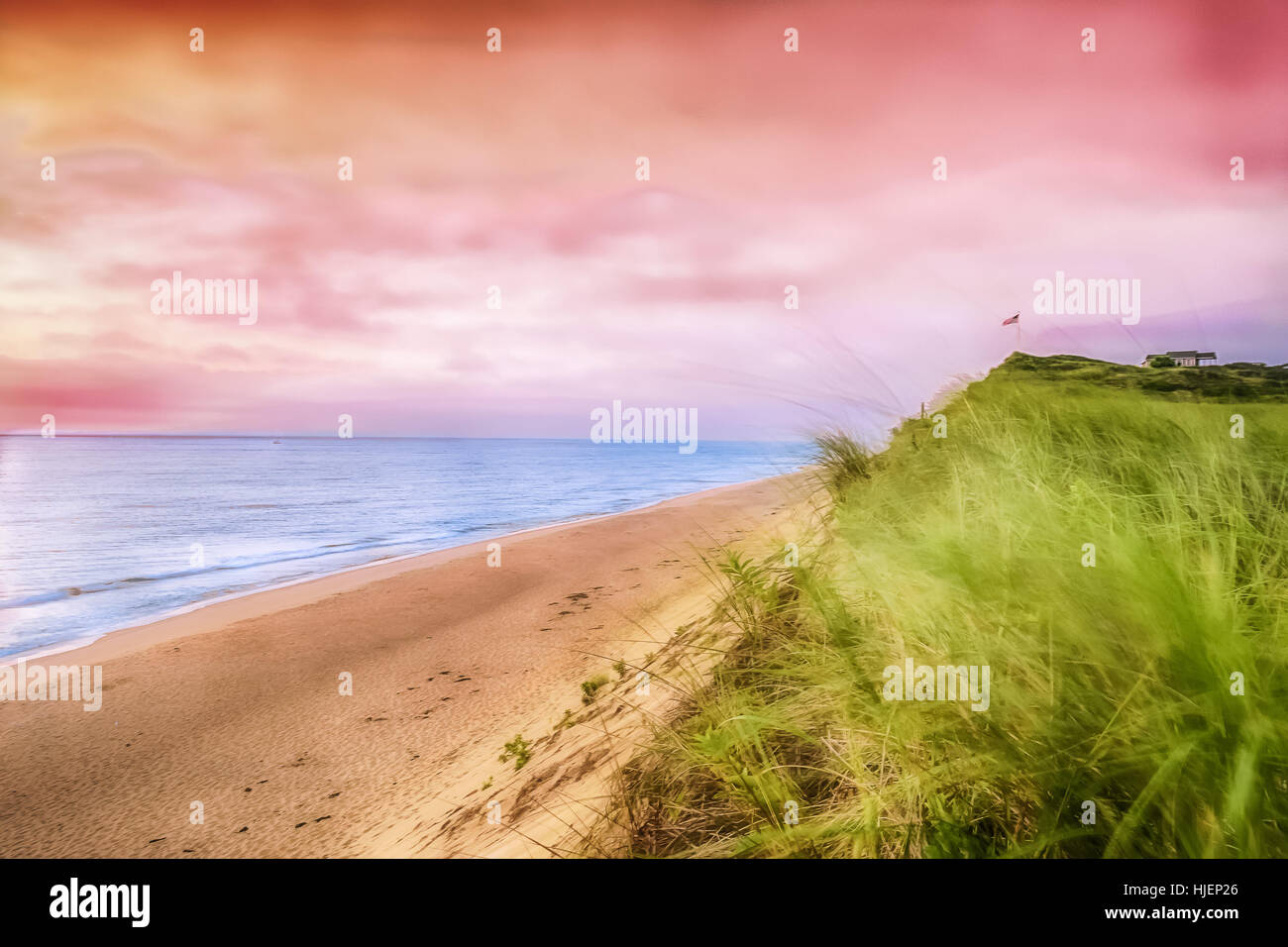 Ein Pastell rosa Sonnenaufgang über einen Strand auf Cape Cod. Stockfoto