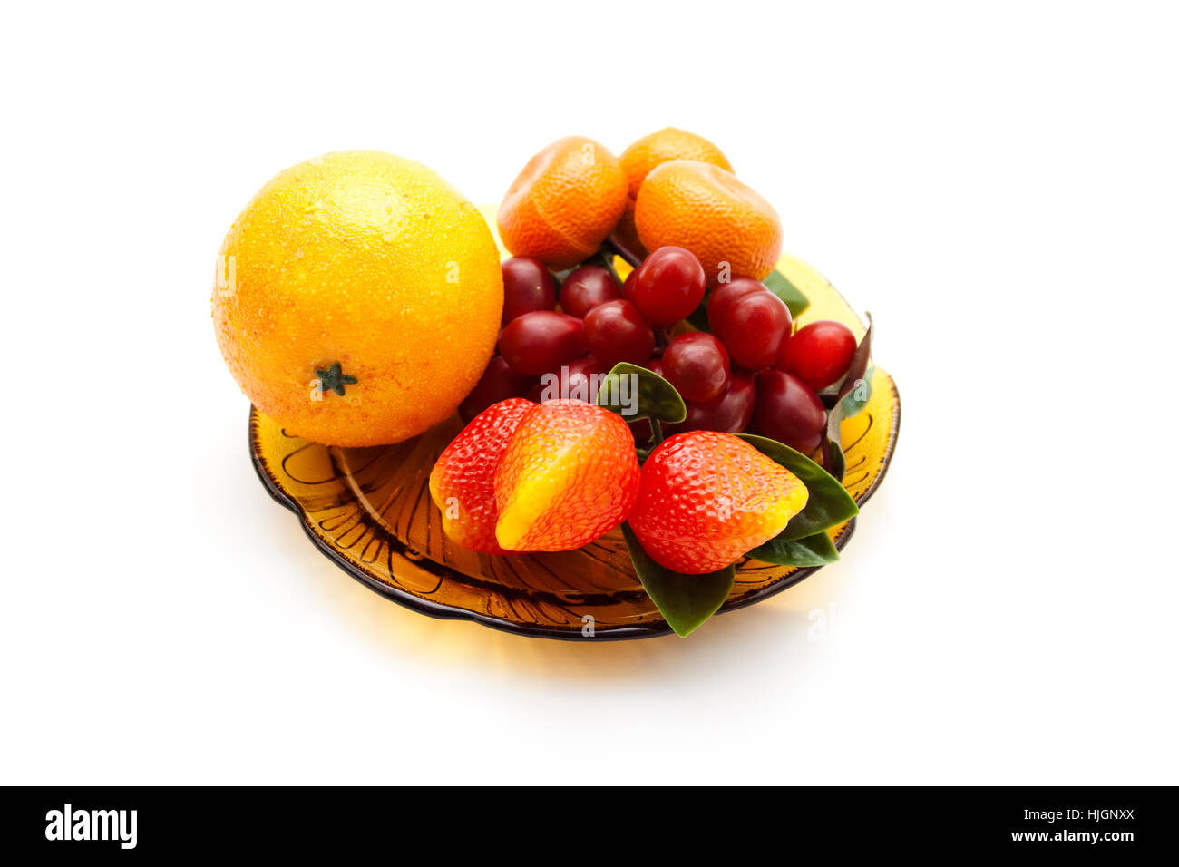 Kunststoff Obst auf Glasplatte Stockfoto