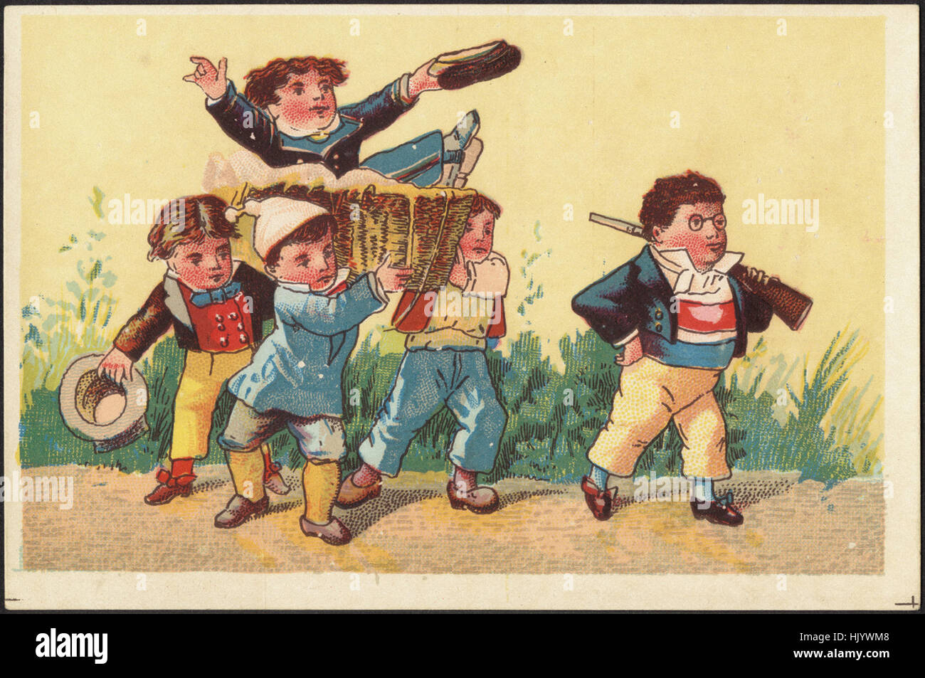 Fünf Jungs, vier zu Fuß und einer in einem Korb durchgeführt werden. Stockfoto