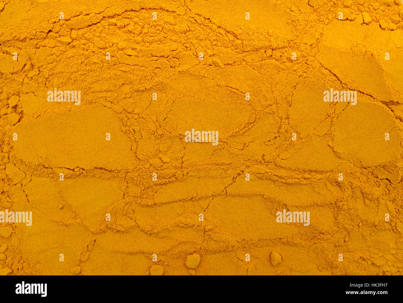 indisches Gewürz Kurkuma Pulver Textur Muster Hintergrund Stockfoto