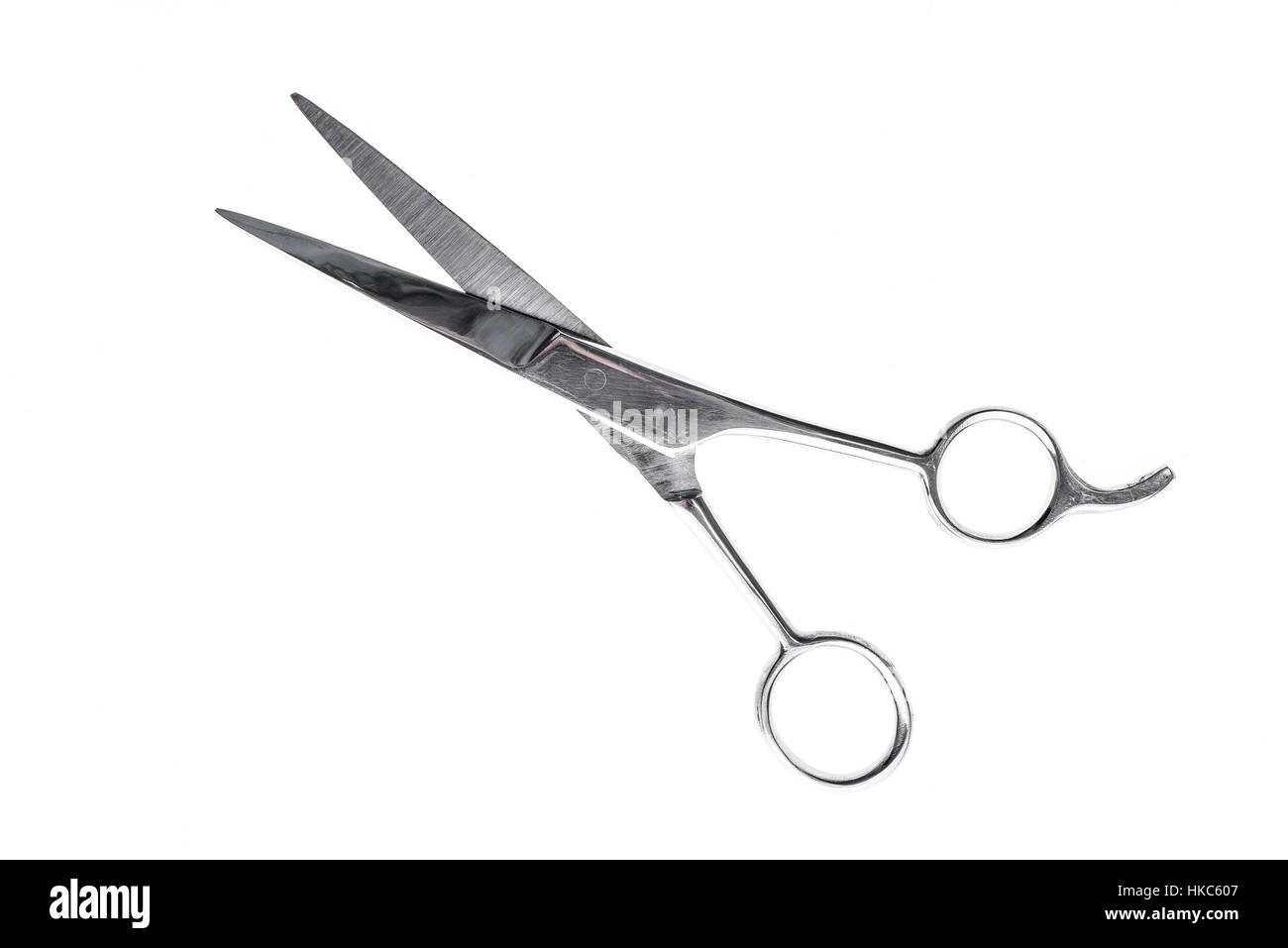 Friseurin oder Friseur Silber professionelle Scheren für Haare schneiden. Isoliert auf weißem Hintergrund Stockfoto