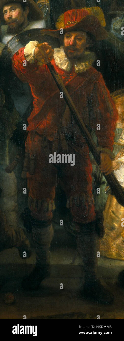 Die Nachtwacht ist ein berühmtes Gemälde von Rembrandt, das einen Mann mit einer Muskete zeigt. Die Szene zeigt eine Milizgruppe in Amsterdam während des 17. Jahrhunderts, die Rembrandts Beherrschung von Licht und Detail bei der Aufnahme dramatischer historischer Momente zeigt. Stockfoto