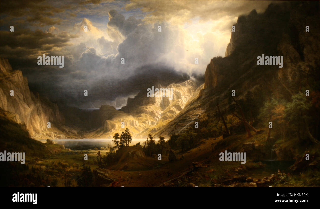 Dieses Gemälde, *A Storm in the Rocky Mountains*, fängt die dramatische und mächtige Landschaft der Rocky Mountains während eines Sturms ein. Der Künstler hebt die rohe Energie der Natur hervor, mit dunklen Sturmwolken und turbulentem Himmel, der die Leinwand dominiert. Es ist eine atemberaubende Darstellung der natürlichen Schönheit und Kraft der Rocky Mountains. Stockfoto