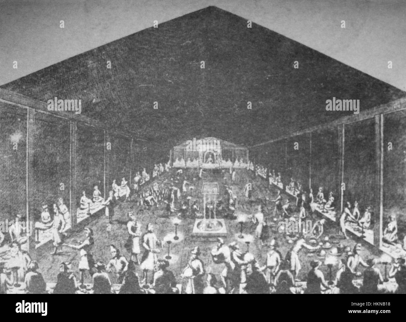 Dieses Ölgemälde von Jean-Baptiste-Siméon Chardin zeigt ein königliches Bankett in Tiflis und zeigt die Opulenz und Kultur des georgischen Hofes. Das Werk veranschaulicht die detaillierte Darstellung von edlem Geschirr, die Eleganz der Einrichtung und den Adel, der bei dem fest anwesend ist. Stockfoto