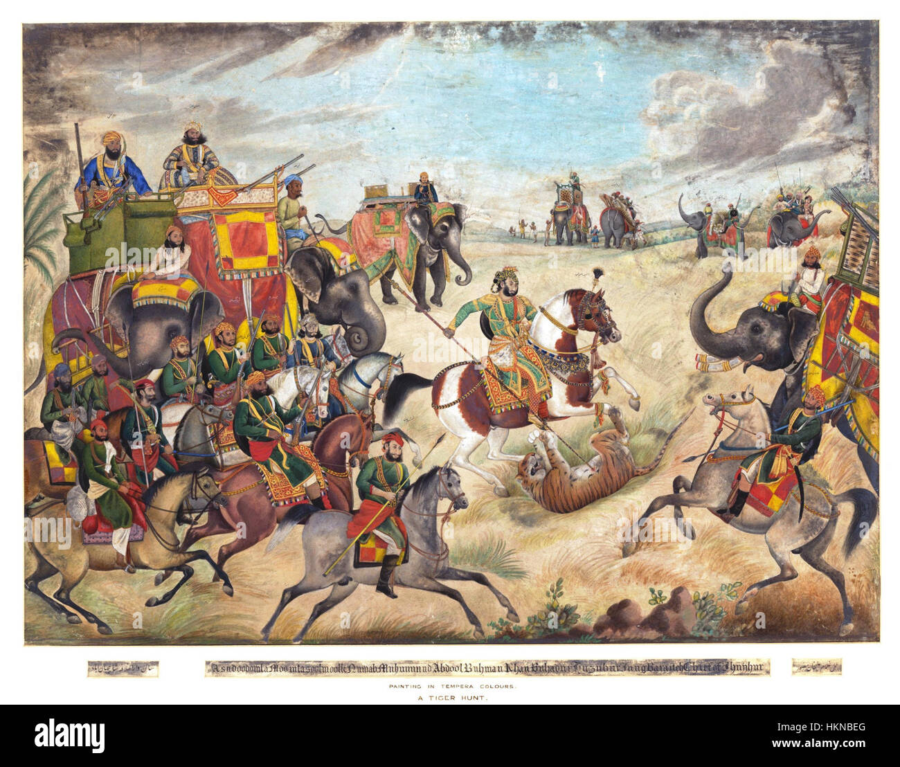 Dieses Gemälde zeigt eine Tigerjagd in der Gegend von Jhajjar im Bezirk Rohtak, Punjab, die die Intensität der Jagd auf dem indischen Subkontinent erfasst. Das Kunstwerk veranschaulicht sowohl die Umgebung als auch die Teilnehmer, die an dieser traditionellen und gefährlichen Aktivität beteiligt sind. Stockfoto