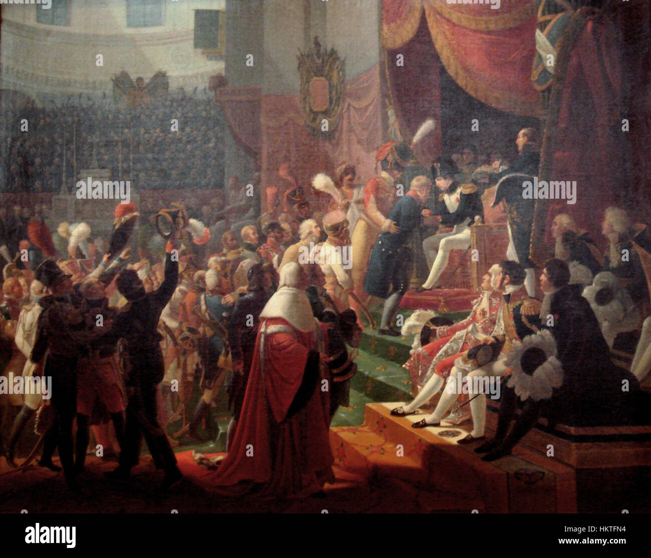 Dieses Gemälde von Jean Baptiste Debret zeigt die erste Überweisung der Legion d’Honneur am 15. Juli 1804 in Saint Louis des Invalides in Paris. Es unterstreicht den zeremoniellen Charakter dieses historischen Ereignisses. Stockfoto