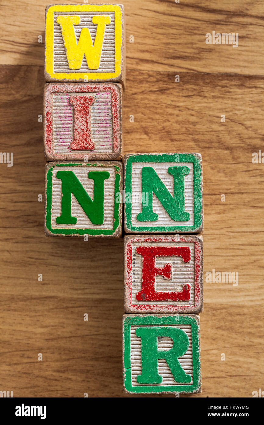 Vintage Kinder Holzblöcke buchstabieren das Wort Gewinner Stockfoto