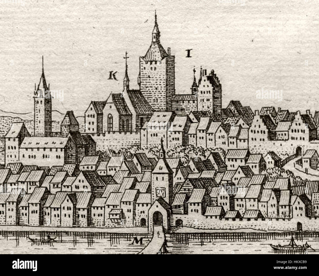 Eine Darstellung der *Burg Breisach*, illustriert von Matthäus Merian, die ihre architektonische Pracht und strategische Lage am Rhein zeigt. Der Stich spiegelt die mittelalterliche Geschichte der Region wider. Stockfoto