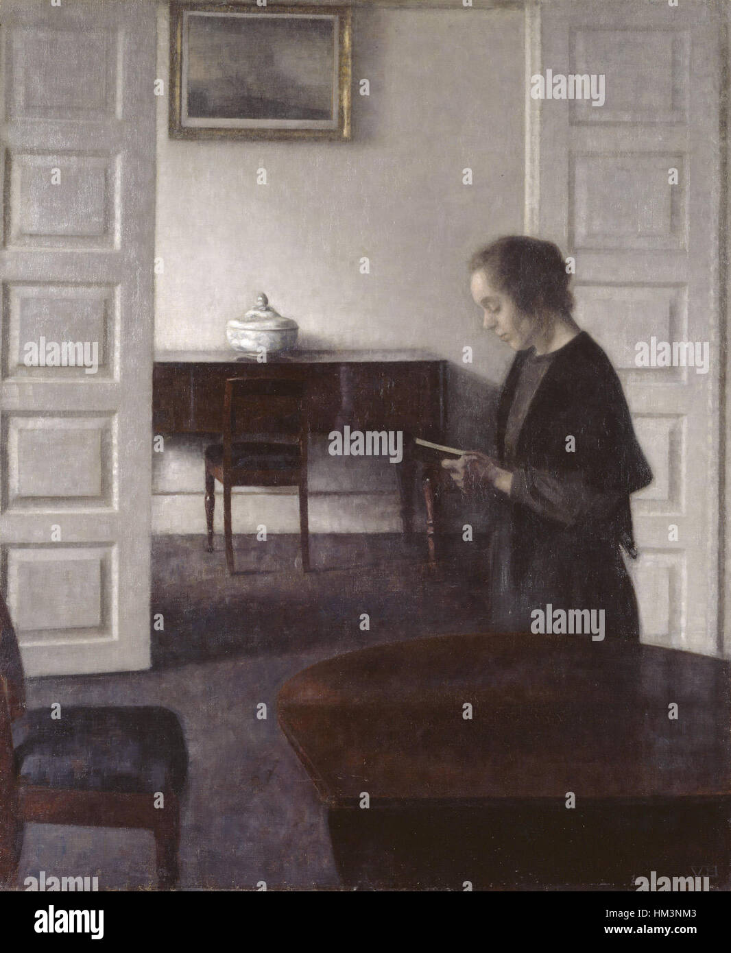 Hammershoi - Innenraum mit einer Lesung Dame Stockfoto