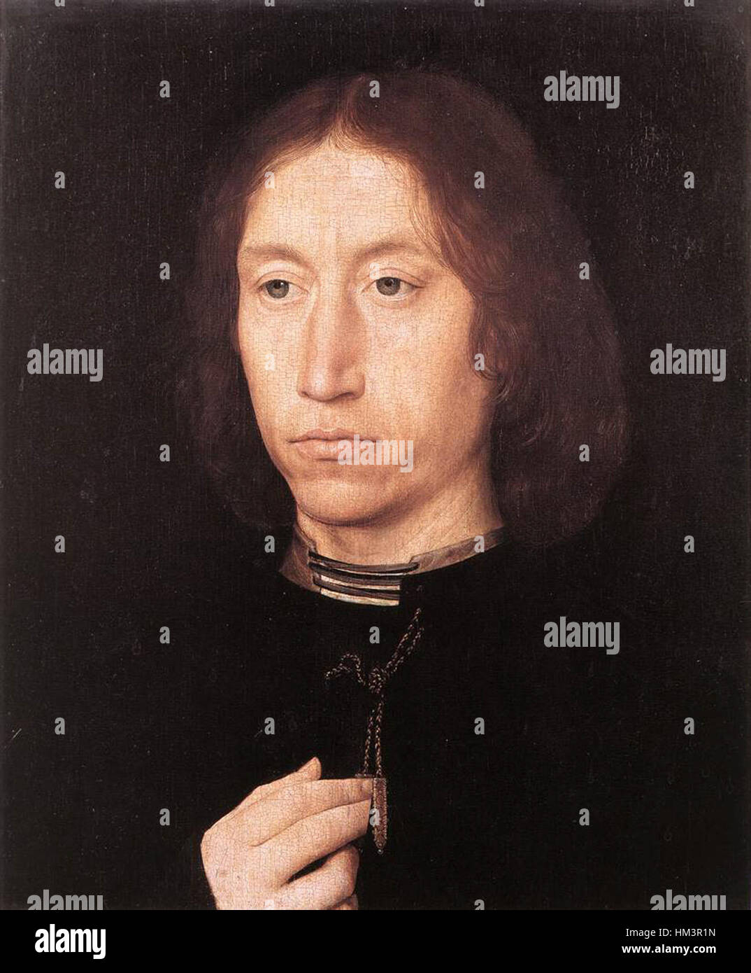 Hans Memlings „Portrait of a man“ ist ein raffiniertes Beispiel für Porträts aus dem 15. Jahrhundert, das den detaillierten Realismus und die Präzision der nördlichen Renaissance unterstreicht. Die Arbeit hebt den Reichtum und Status des Sitters durch sorgfältige Detailgenauigkeit hervor. Stockfoto