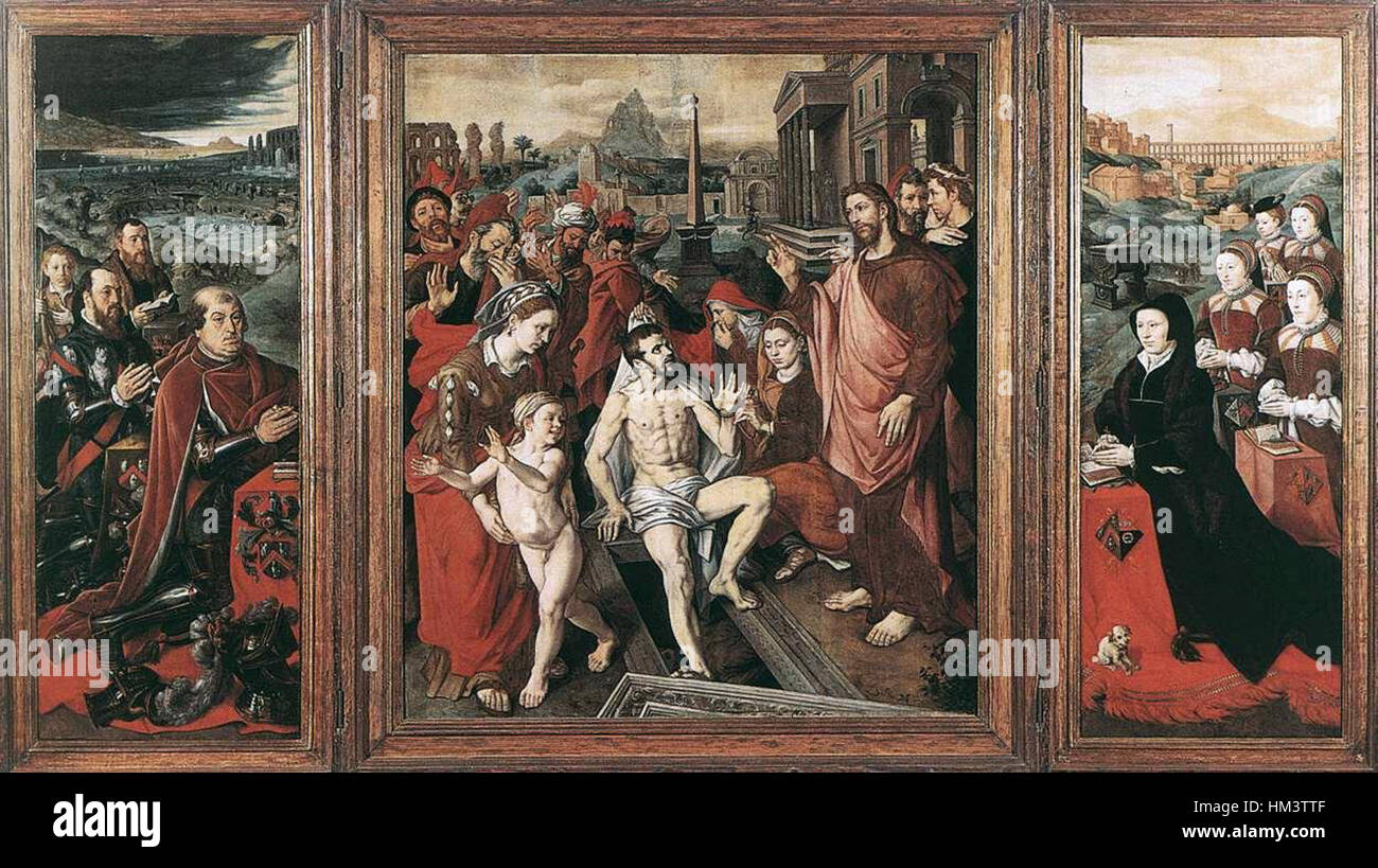 Dieses Triptychon von Jan Cornelisz Vermeyen stellt die Familie Micault in einer detaillierten, religiösen Komposition dar. Das Gemälde zeigt den Reichtum und den Status der Familie, mit einer komplizierten Aufmerksamkeit für Kleidung, Gesichtsausdrücke und symbolische Elemente, die die Porträts des 16. Jahrhunderts widerspiegeln. Stockfoto Dieses Triptychon von Jan Cornelisz Vermeyen stellt die Familie Micault in einer detaillierten, religiösen Komposition dar. Das Gemälde zeigt den Reichtum und den Status der Familie, mit einer komplizierten Aufmerksamkeit für Kleidung, Gesichtsausdrücke und symbolische Elemente, die die Porträts des 16. Jahrhunderts widerspiegeln. Stockfoto