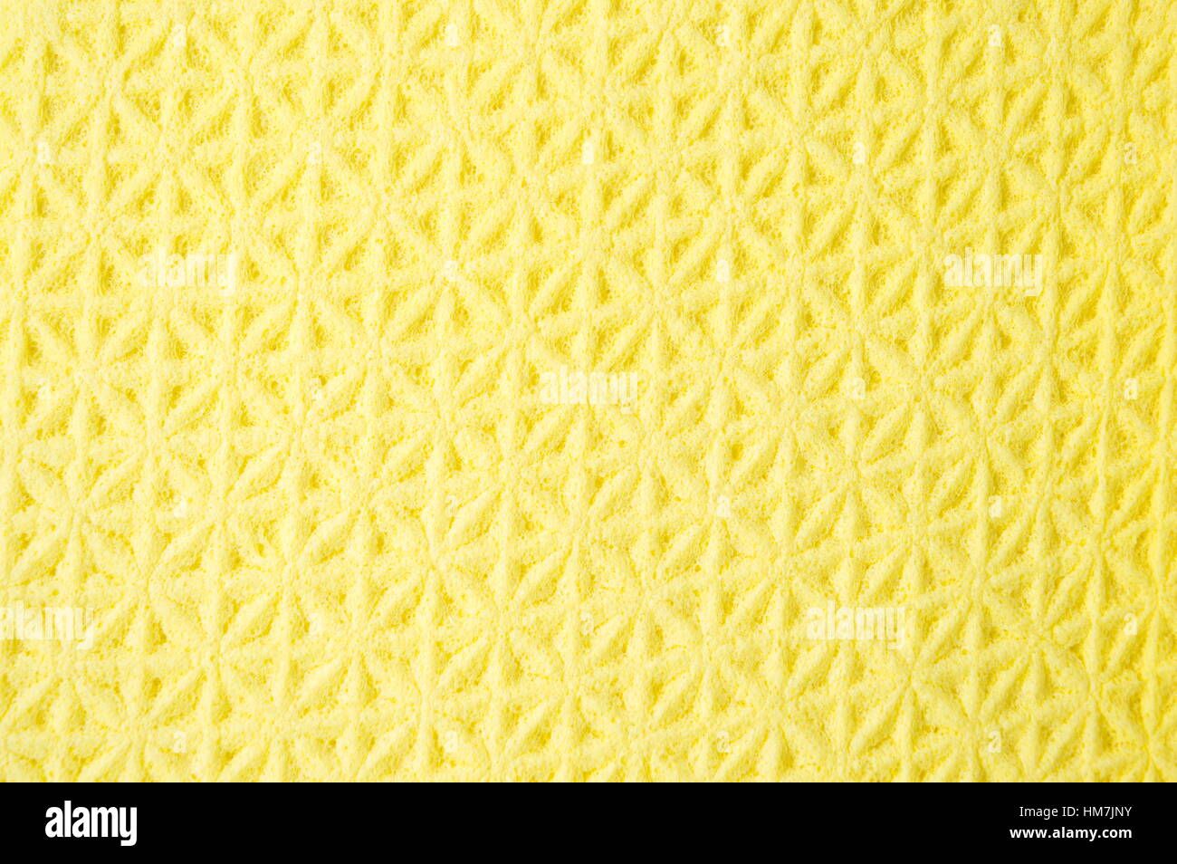 Gelbes Tuch Hintergrund Reinigungsmuster hautnah Stockfoto