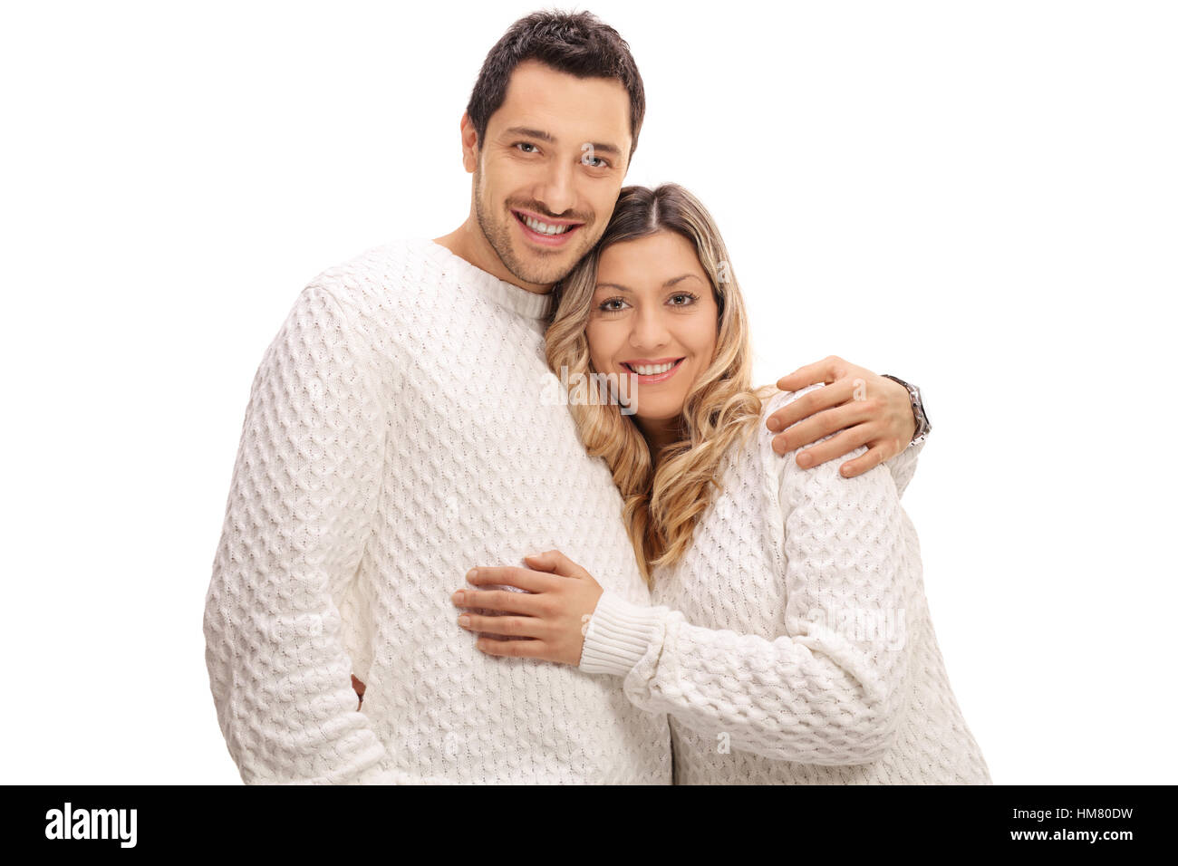 Glückliches junges Paar in einer Umarmung, die isoliert auf weißem Hintergrund Stockfoto