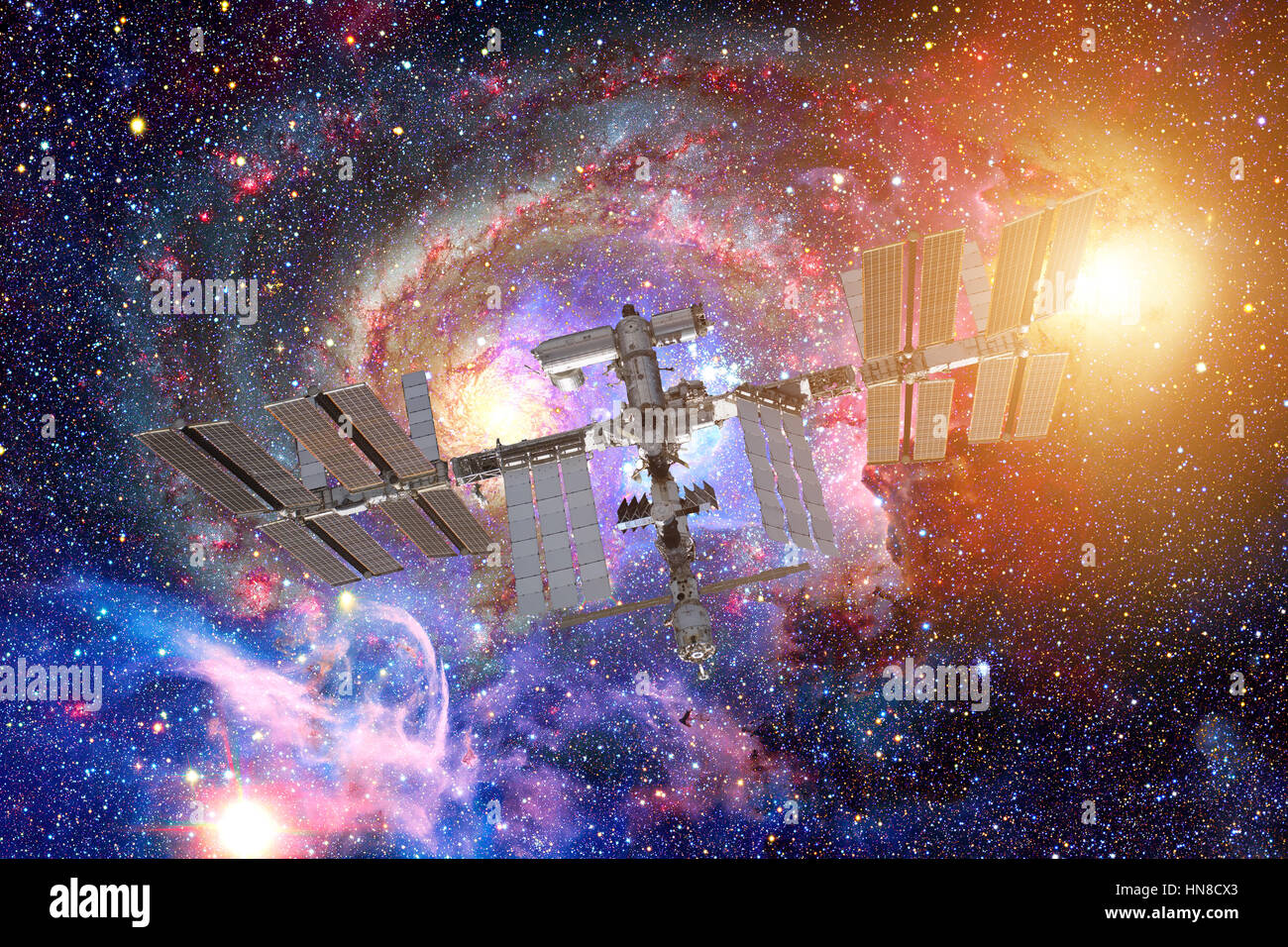 Internationale Raumstation ISS über Spiralgalaxie Erde. Elemente des Bildes von der NASA eingerichtet. Stockfoto