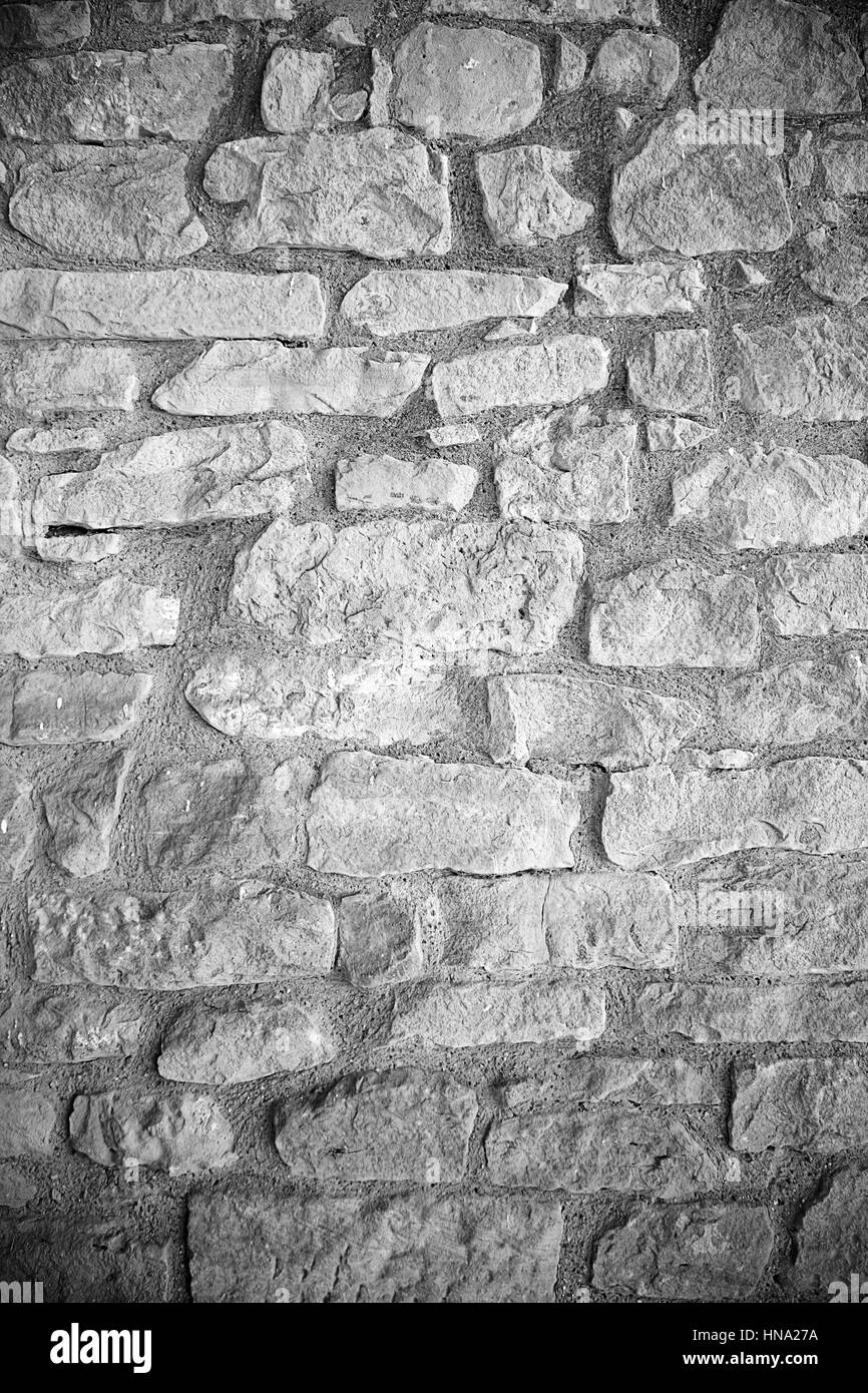 Alte Steinmauer, Stein Wand Detail in der Stadt, alte strukturierten Hintergrund Stockfoto
