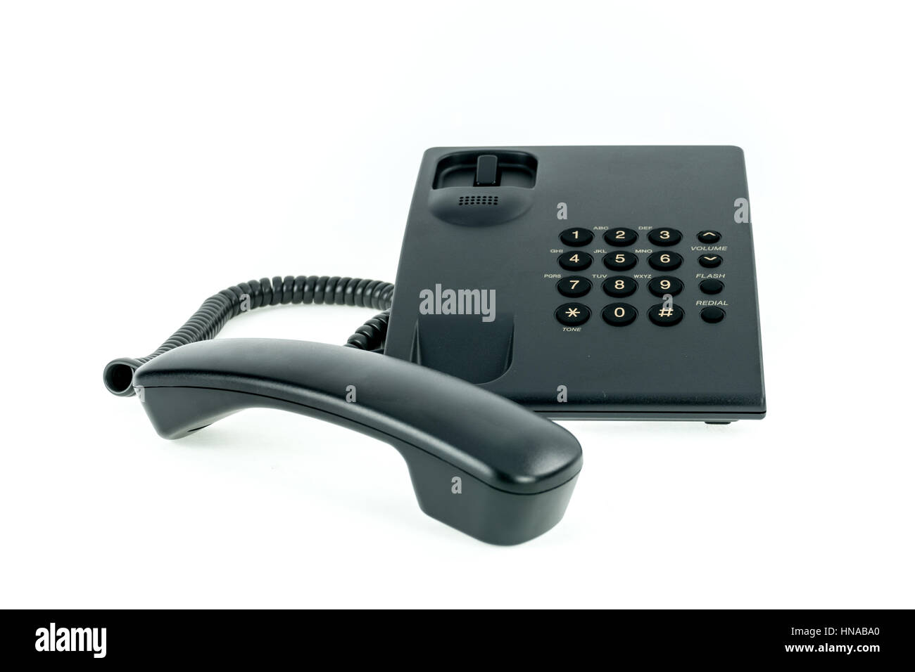 Schwarz Telefon mit Mobilteil in der Nähe auf dem weißen Hintergrund isoliert Stockfoto