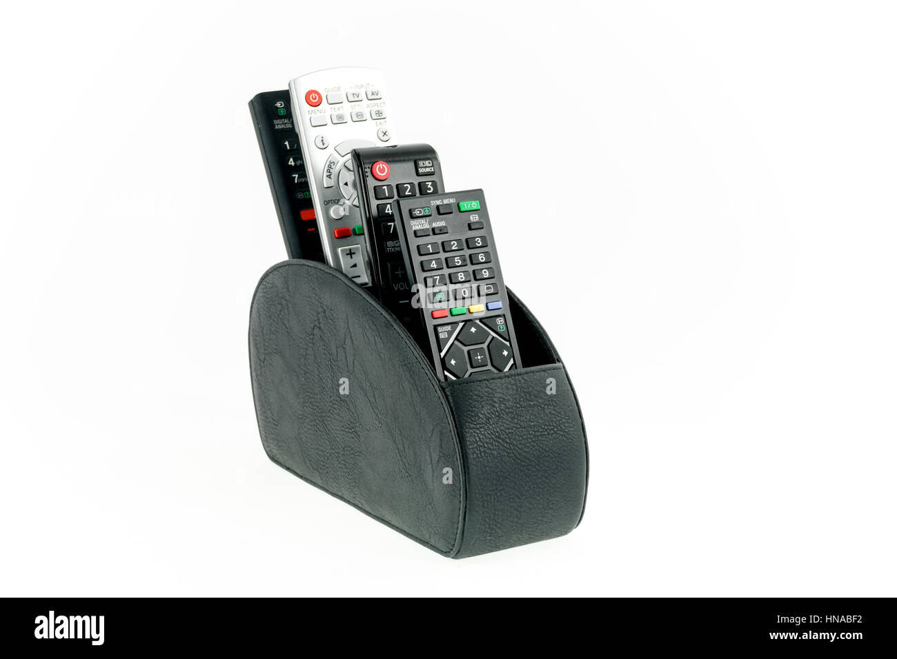 Fernbedienungen in Leder Halter isoliert auf weißem Hintergrund Stockfoto