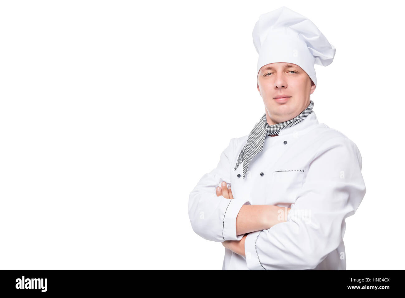 Koch in Uniform und einen weißen Raum auf der linken Hintergrundseite Stockfoto