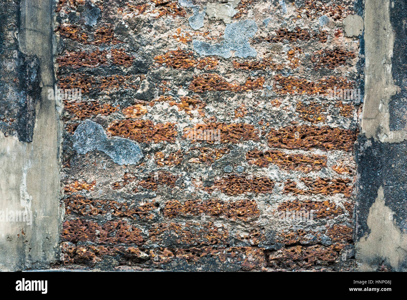 Alte historische Laterit-Mauer, Hintergrund / Textur Stockfoto