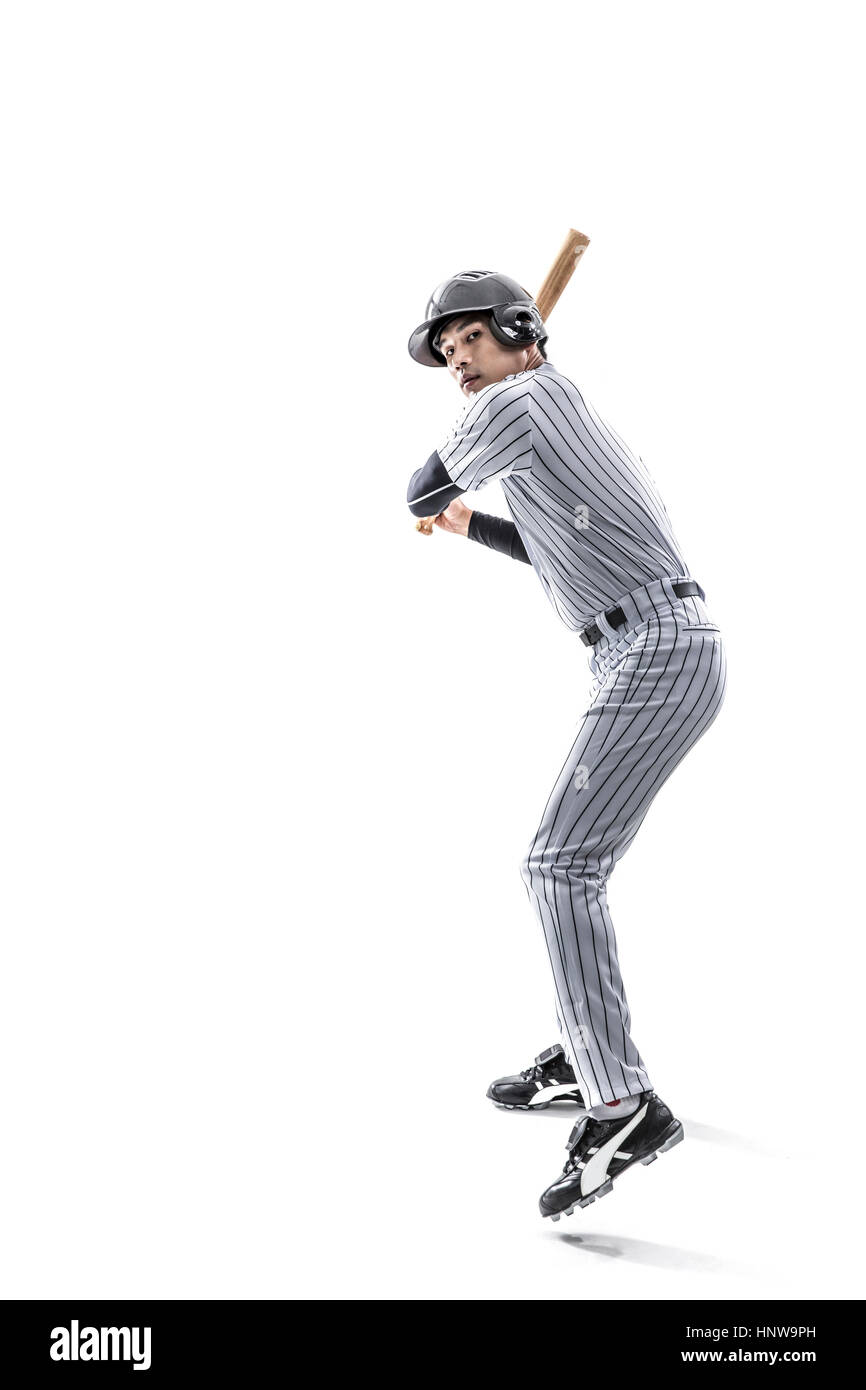 Baseball-Spieler mit einer Fledermaus posiert Stockfoto