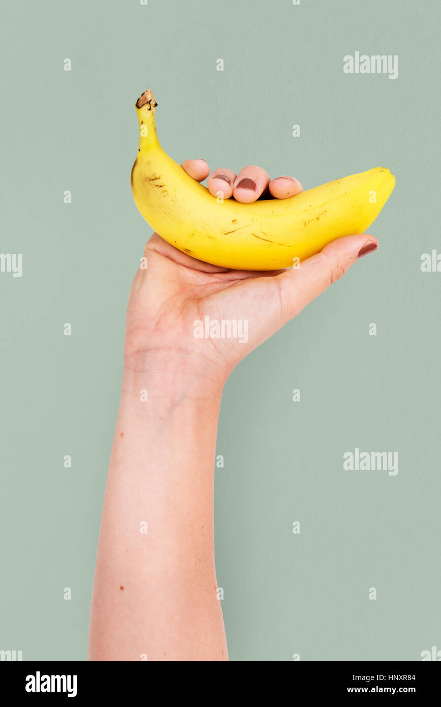 Halten Banane Frucht Studio Konzept Stockfoto