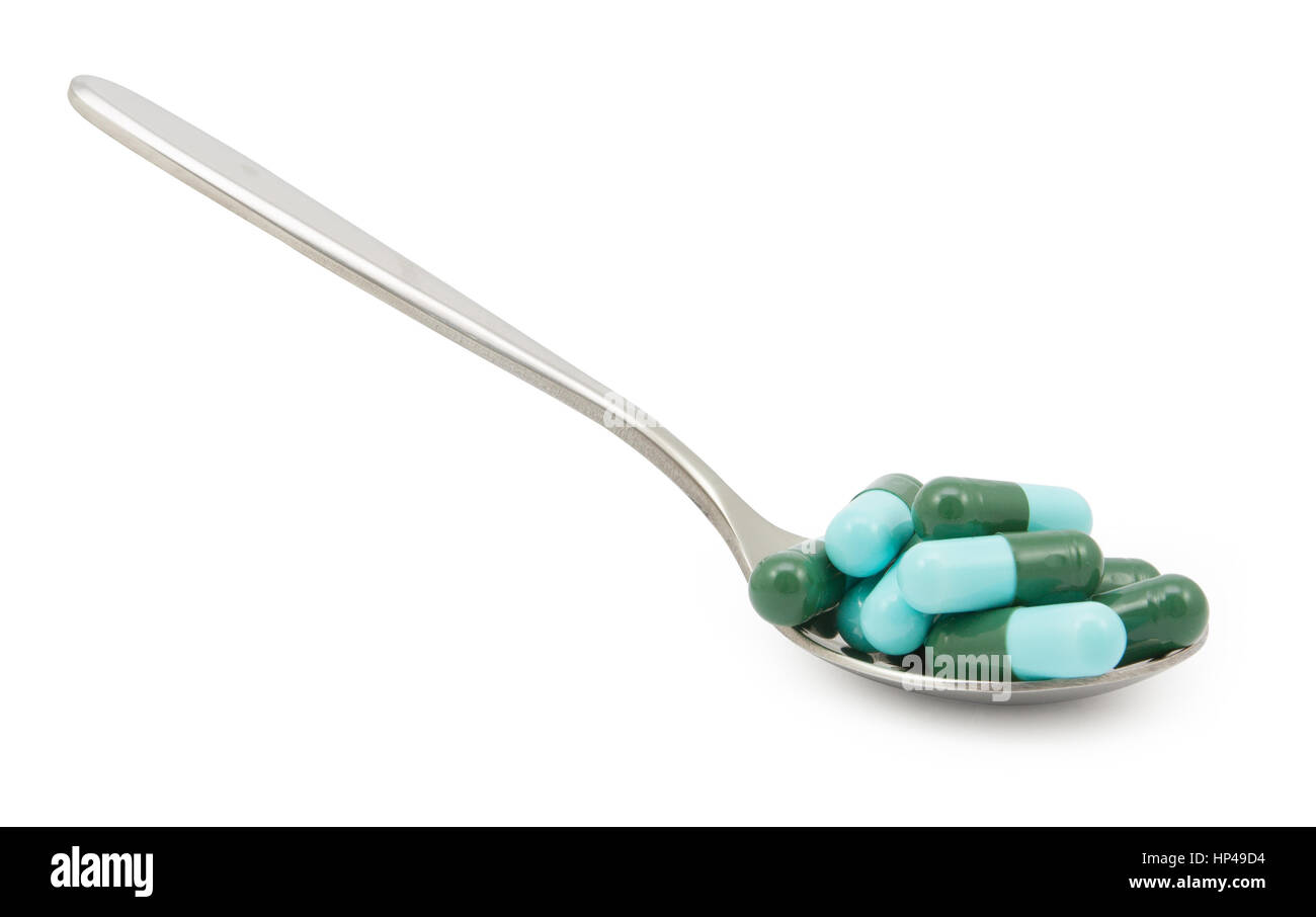 Viele Pillen Medikamente auf Löffel.  Datei enthält einen ausgezeichnete Beschneidungspfad Stockfoto