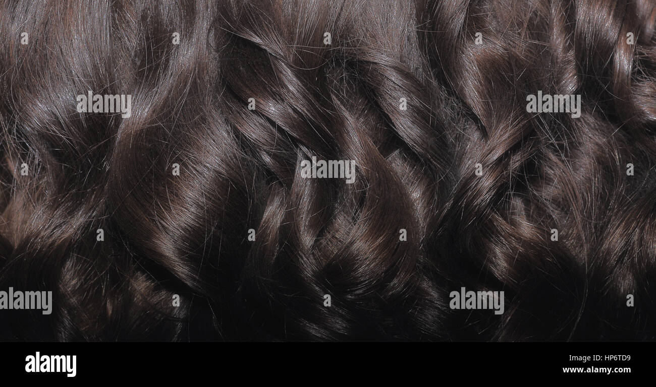 Schwarzes Haar Nahaufnahme. Schwarzes Haar Schleusen Kulisse. Stockfoto