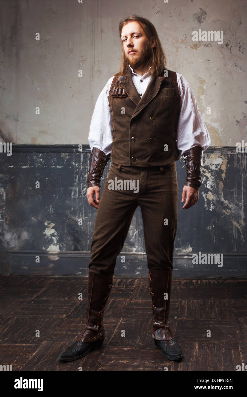 Gut aussehend männlichen Steam Punk. Retro-Mann Porträt über Grunge Hintergrund. Stockfoto