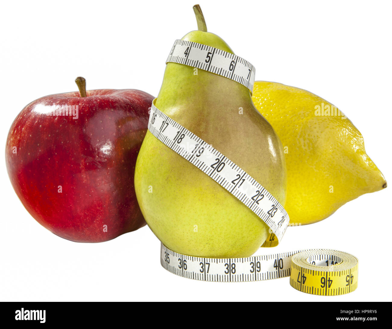 Apfel, Birne und Zitrone mit Massband Stockfoto