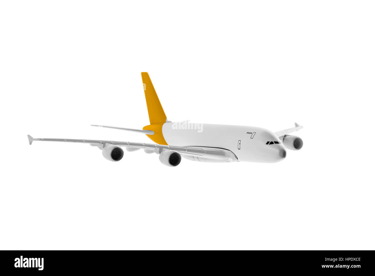 Flugzeug mit gelber Farbe, isoliert auf weißem Hintergrund. Stockfoto