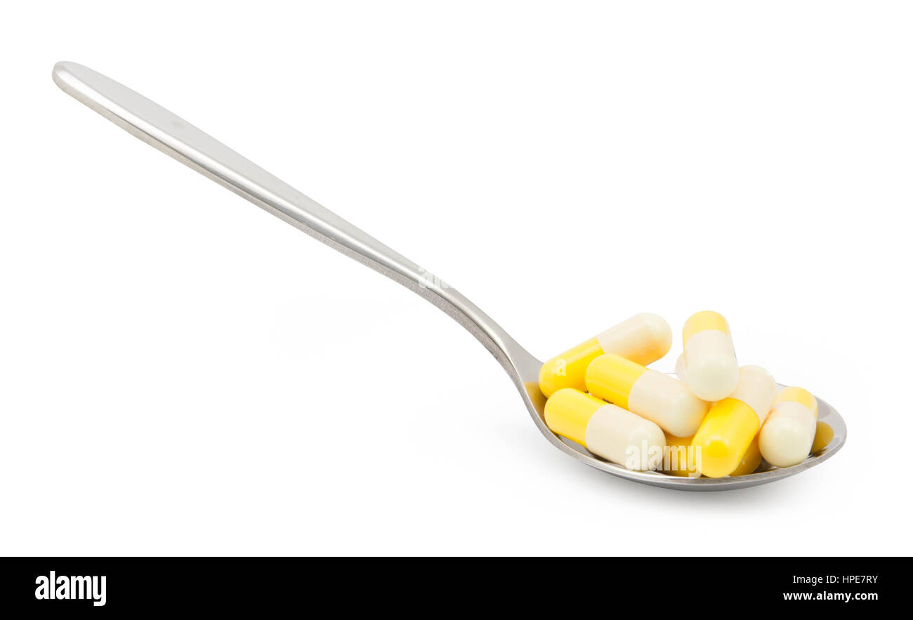 Viele Pillen Medikamente auf Löffel.  Datei enthält einen ausgezeichnete Beschneidungspfad Stockfoto