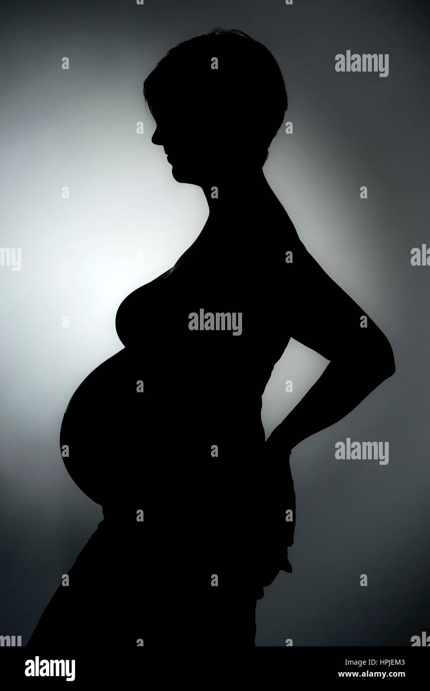 Model Release, Schwangere Frau als Silhouette - schwangere Frau als Silhouette Stockfoto