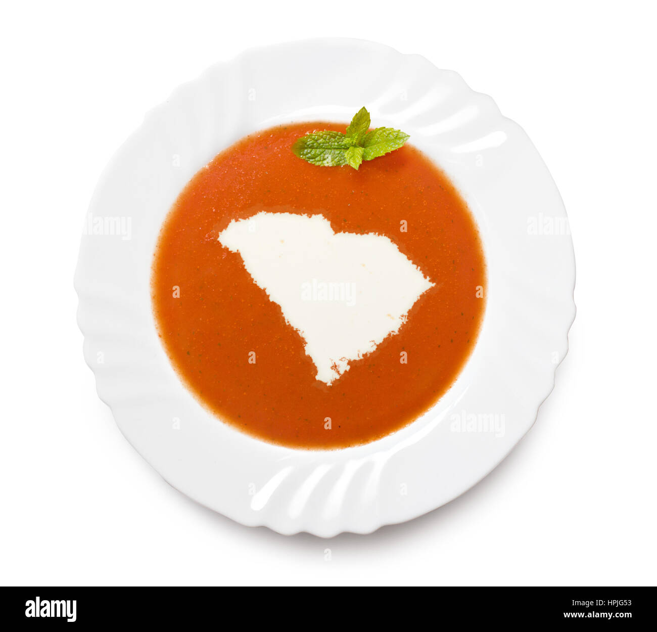 Ein Teller Tomatensuppe mit Sahne in der Form von South Carolina. (Serie) Stockfoto