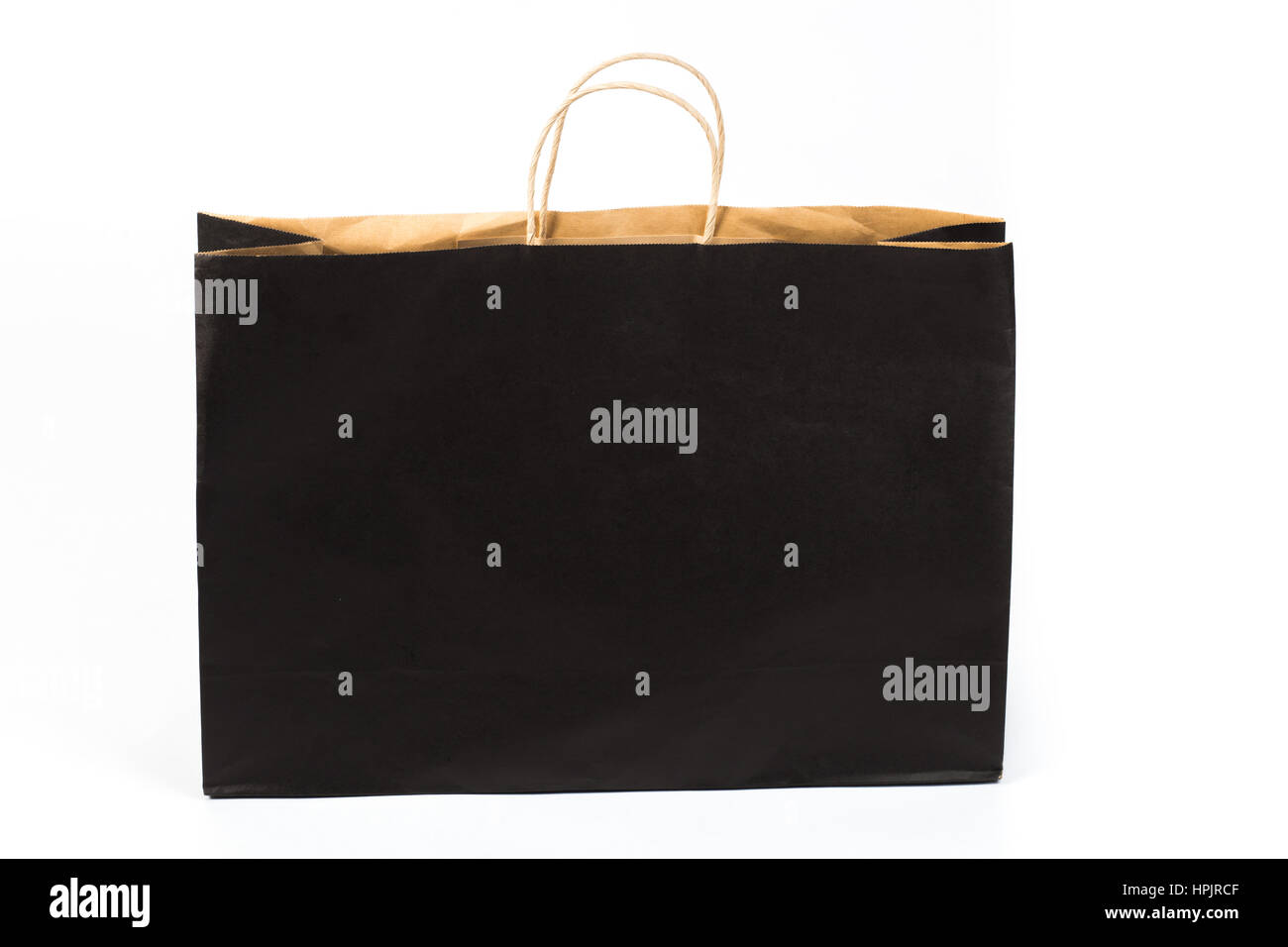 Schwarze Einkaufstasche mit Griff isoliert auf weiss Stockfoto