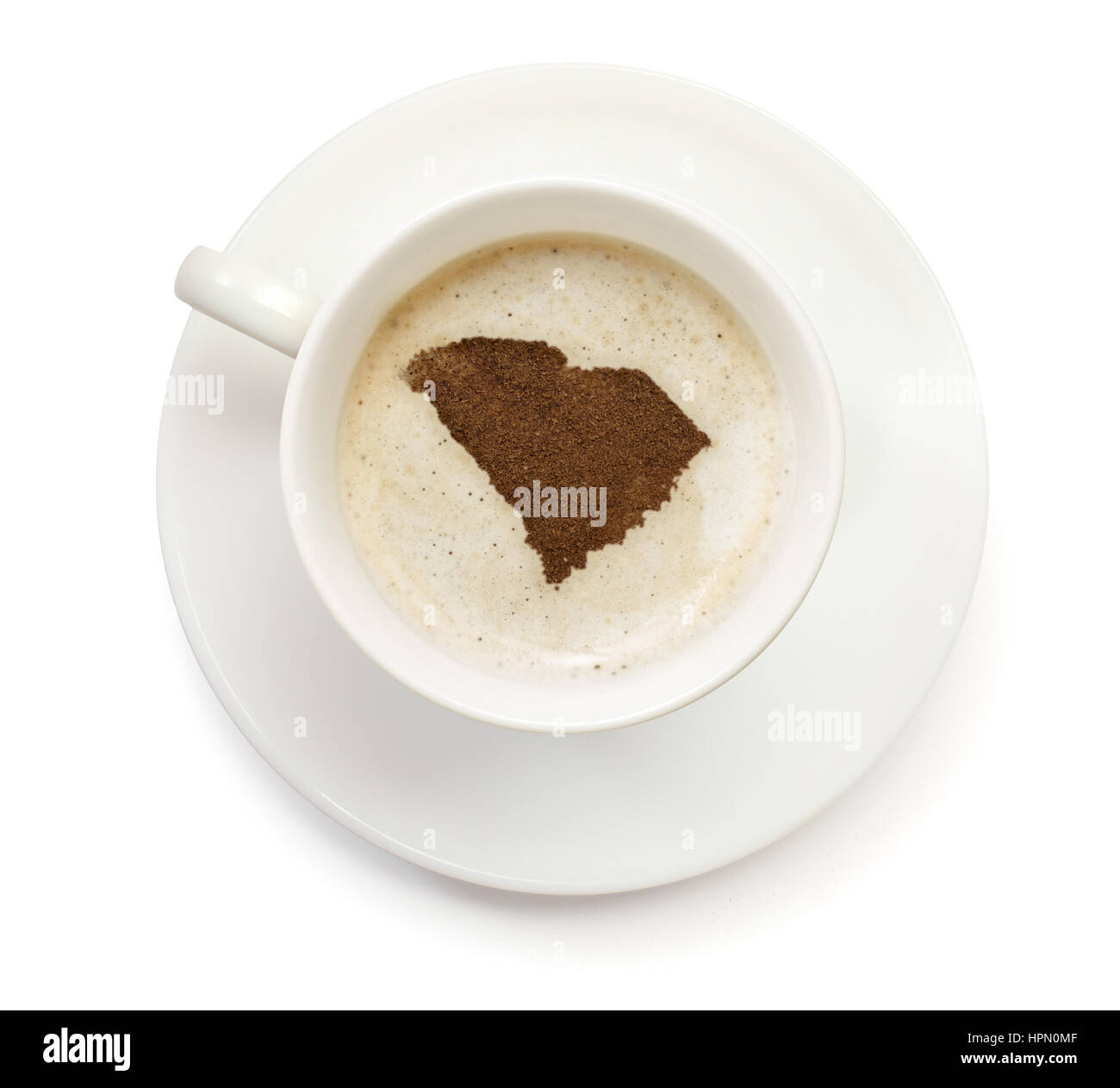 Eine Tasse Kaffee mit Schaum und Pulver in Form von South Carolina. (Serie) Stockfoto