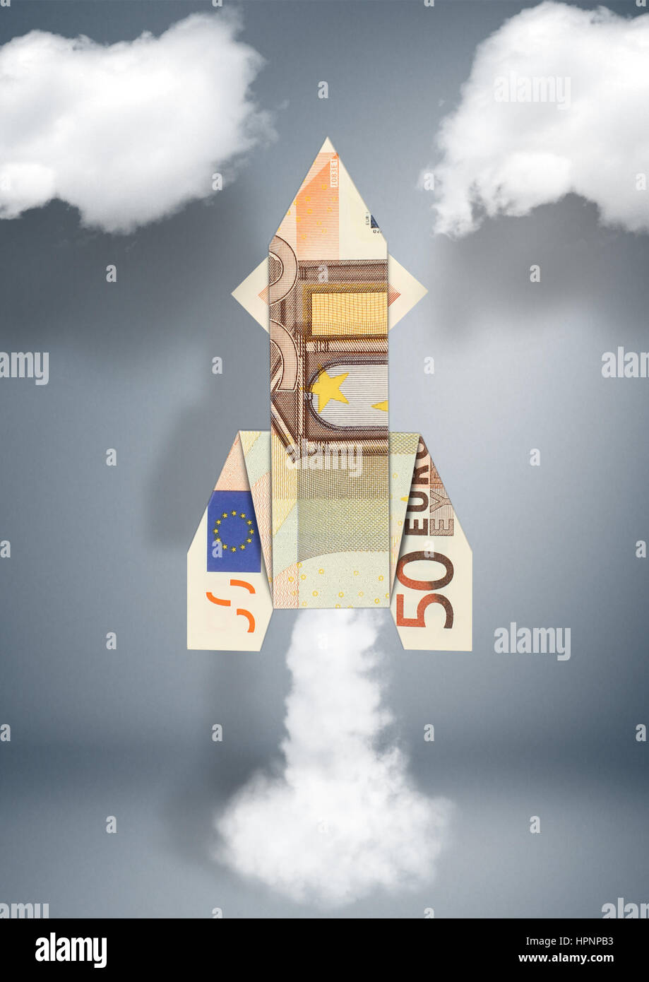 finanzielles Konzept, Rakete Geld gemacht Stockfoto