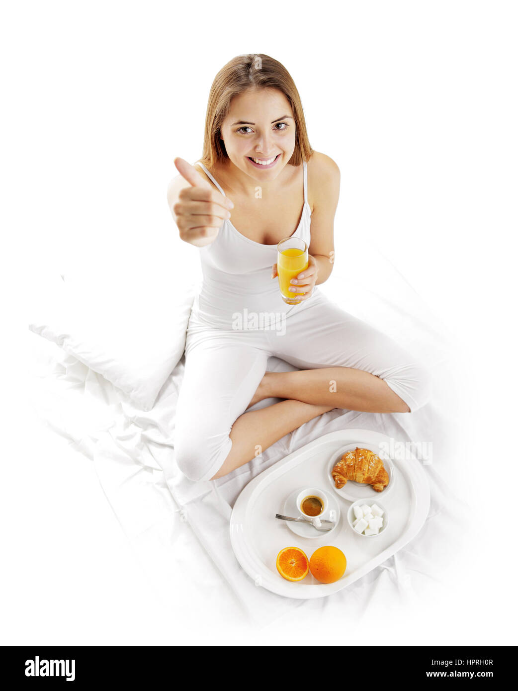 Frau, Frühstück im Bett aufwachen Stockfoto