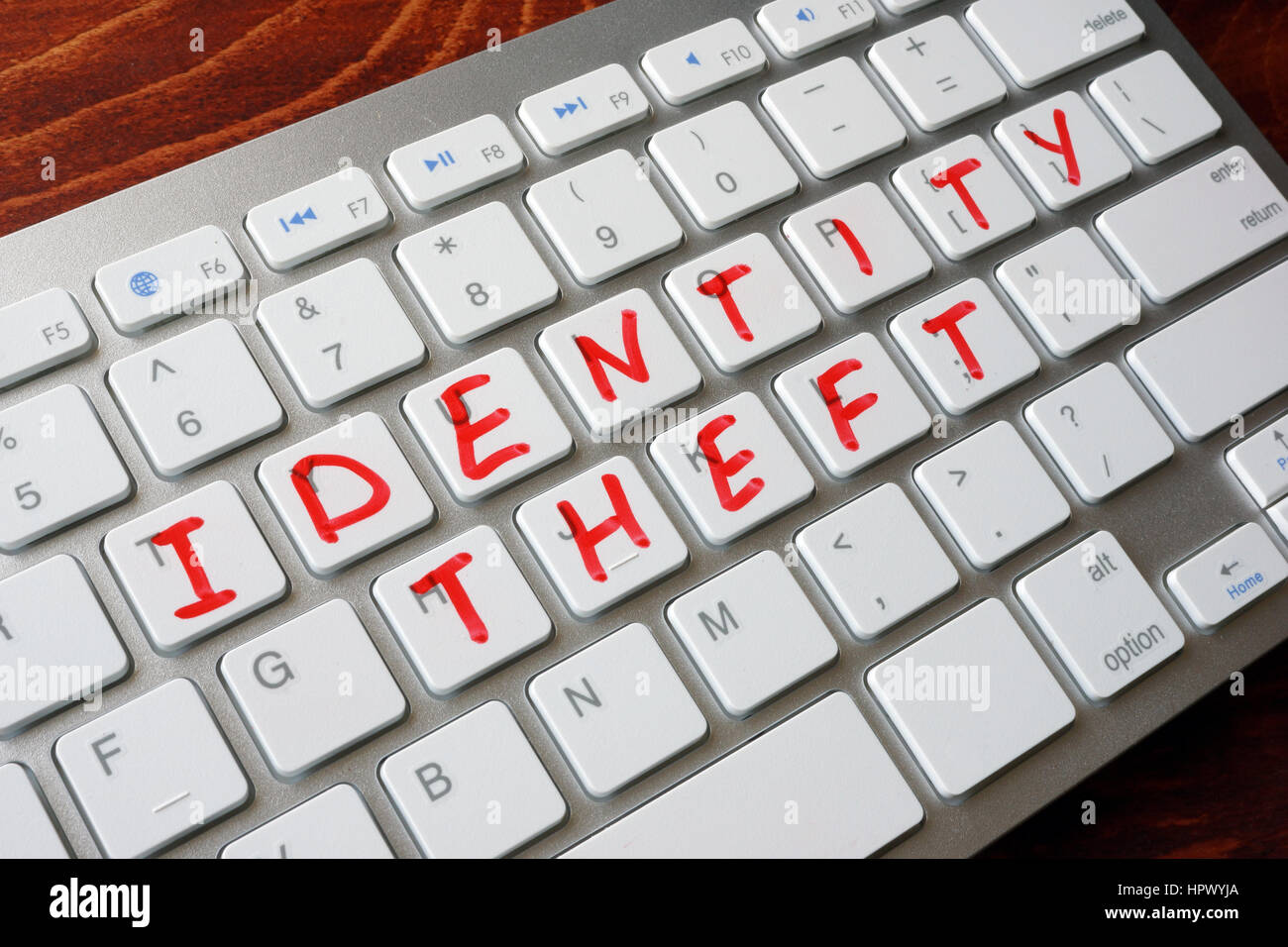 Identitäts-Diebstahl auf einer Tastatur geschrieben. Stockfoto
