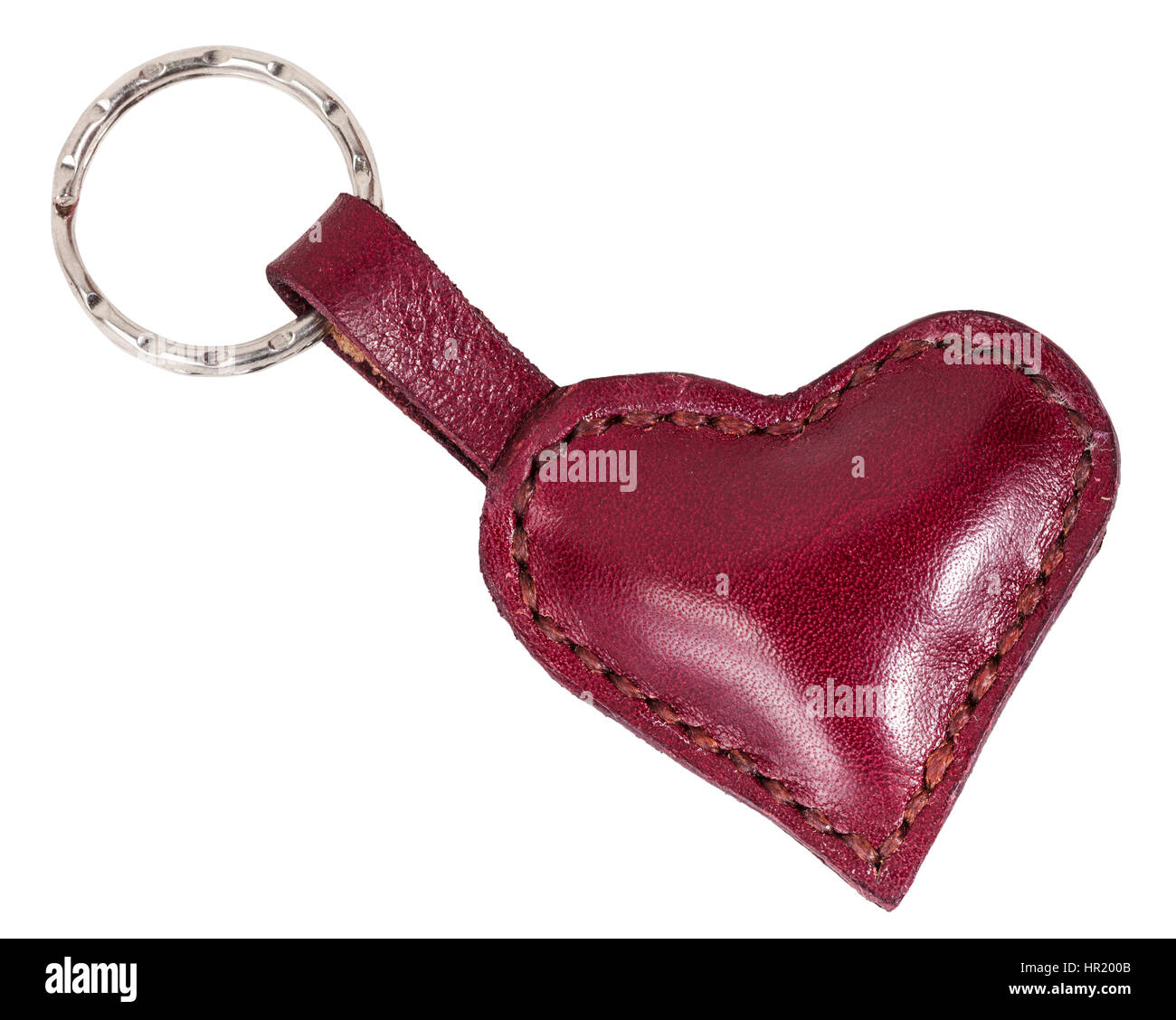 rotem Leder Herz Form Schlüsselanhänger isoliert auf weißem Hintergrund Stockfoto