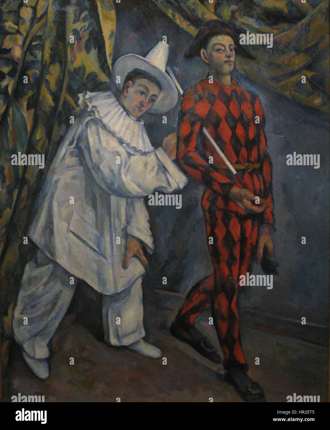 Das Gemälde „Pierrot and Harlequin“ eines unbekannten Künstlers zeigt zwei ikonische Figuren der Commedia dell'arte, die oft mit Mardi Gras-Feiern in Verbindung gebracht werden. Die übertriebenen Merkmale und farbenfrohen Kostüme der Charaktere unterstreichen die festliche Atmosphäre des Karnevals. Stockfoto