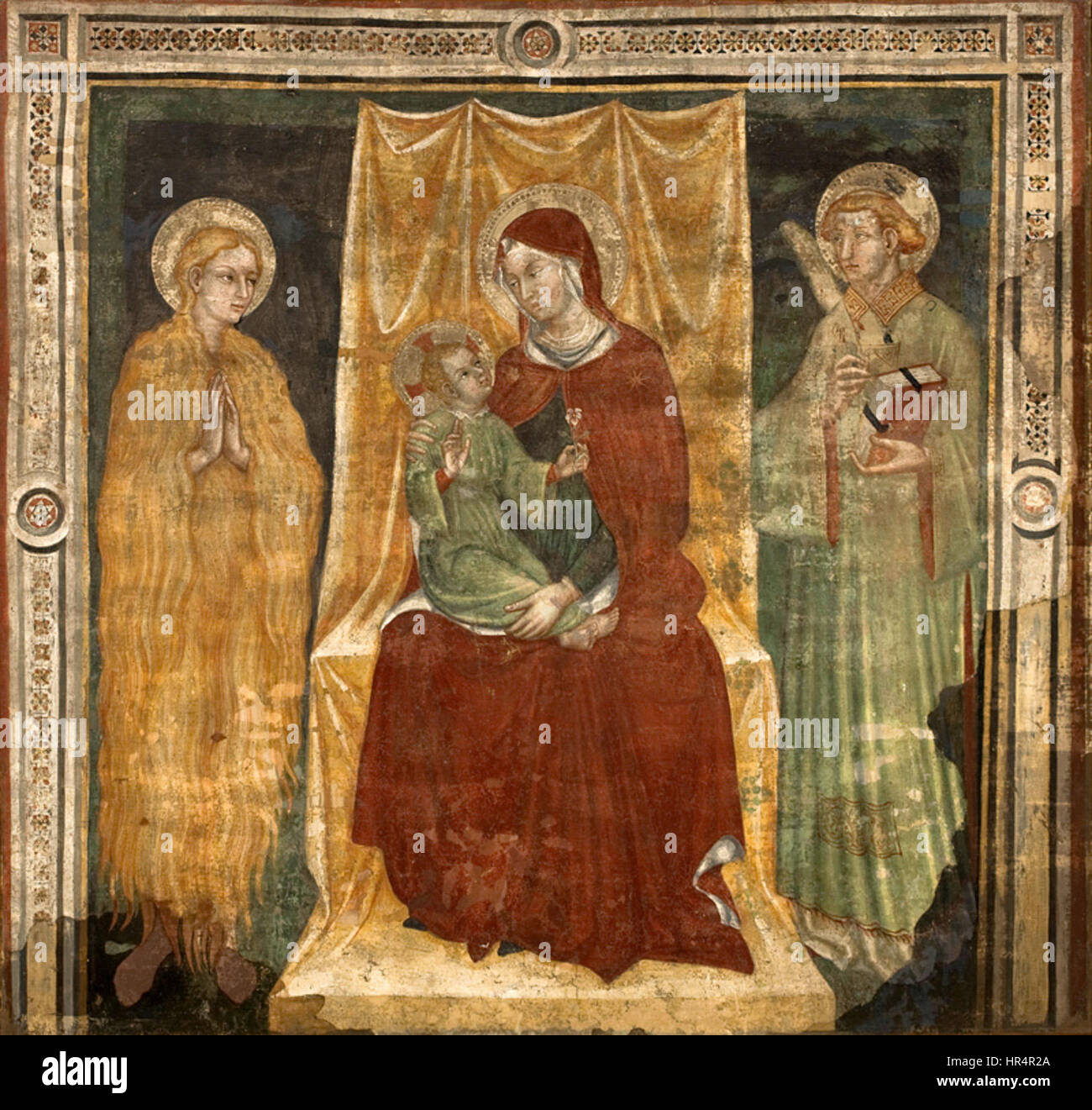 Dieses Werk von Ottaviano Nelli zeigt die Madonna mit dem Kind und den Heiligen und zeigt seine Meisterschaft in der religiösen Kunst während der Renaissance. Das Werk zeigt detaillierte religiöse Ikonographie und weiche Farbpaletten. Stockfoto