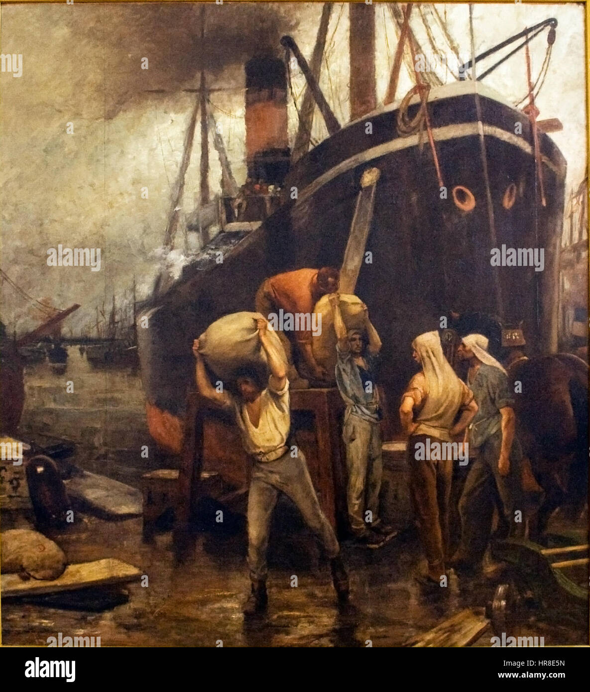 Der Hafen ist eine maritime Szene, die einen geschäftigen Hafen mit Schiffen und Hafenarbeitern darstellt. Das Gemälde konzentriert sich auf das tägliche Leben und die Aktivität eines Hafens im 19. Jahrhundert und erfasst die Bewegung und Energie des arbeitenden Hafens. Stockfoto