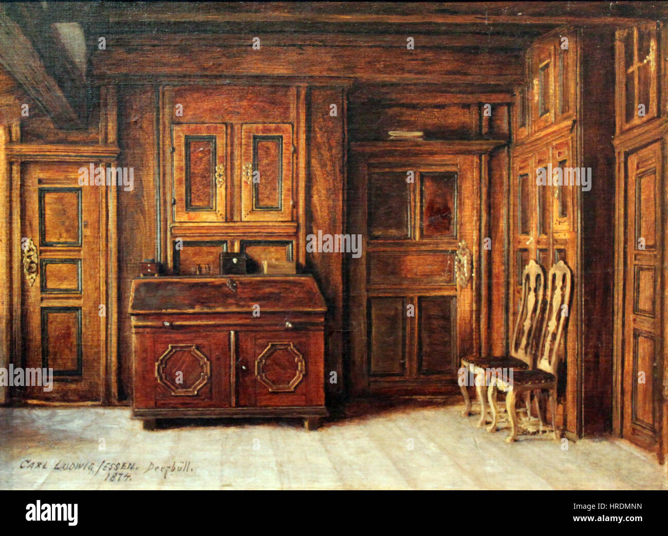 Die „Braune Stube“ von Jessen aus dem Jahr 1874 zeigt eine intime Inneneinrichtung, wahrscheinlich ein rustikaler Raum, der im traditionellen europäischen Stil eingerichtet ist. Die Arbeit betont Licht und Schatten, um die gemütliche und heimelige Atmosphäre des Raumes zu verbessern. Stockfoto