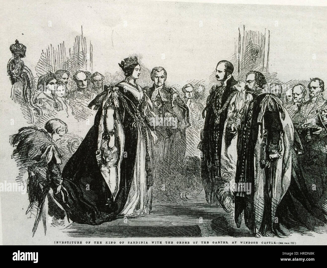 Dieses Bild zeigt Königin Victoria und den König von Sardinien in zeremoniellen Strumpfkleidern. Der Orden des Garters ist eine der prestigeträchtigsten Ehren in der britischen Monarchie, und dieses Bild unterstreicht die formale Kleidung, die während der Zeremonie getragen wurde, und unterstreicht die königliche und diplomatische Bedeutung solcher Ereignisse im 19. Jahrhundert. Stockfoto