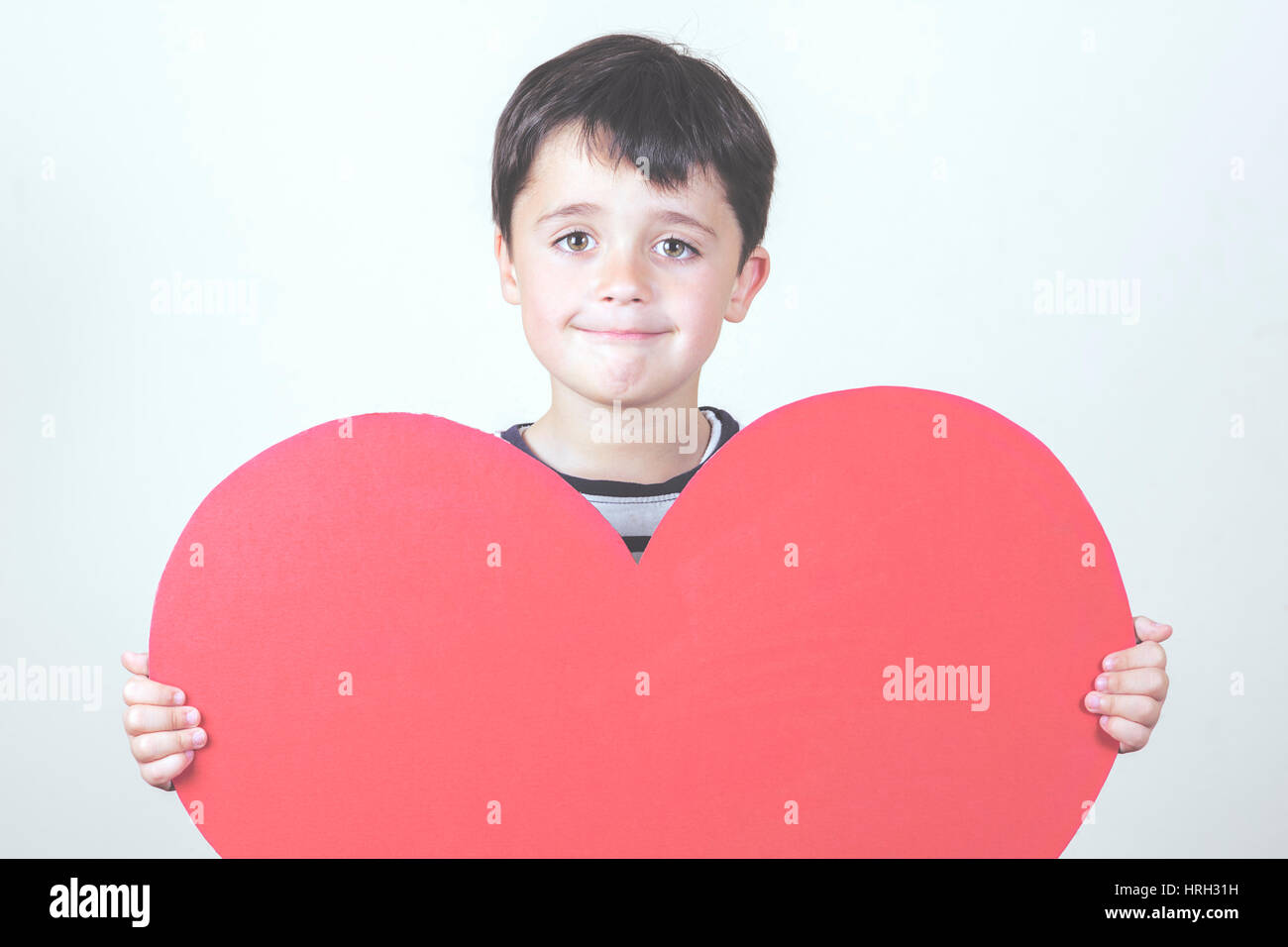glückliches Kind mit Herzen zum Valentinstag Stockfoto
