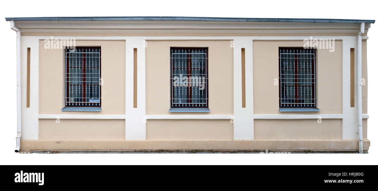 Gelbe Fassade des einstöckigen standard Stadt. Drei Fenster mit Metall-Gitter. Isolierten fragment Stockfoto