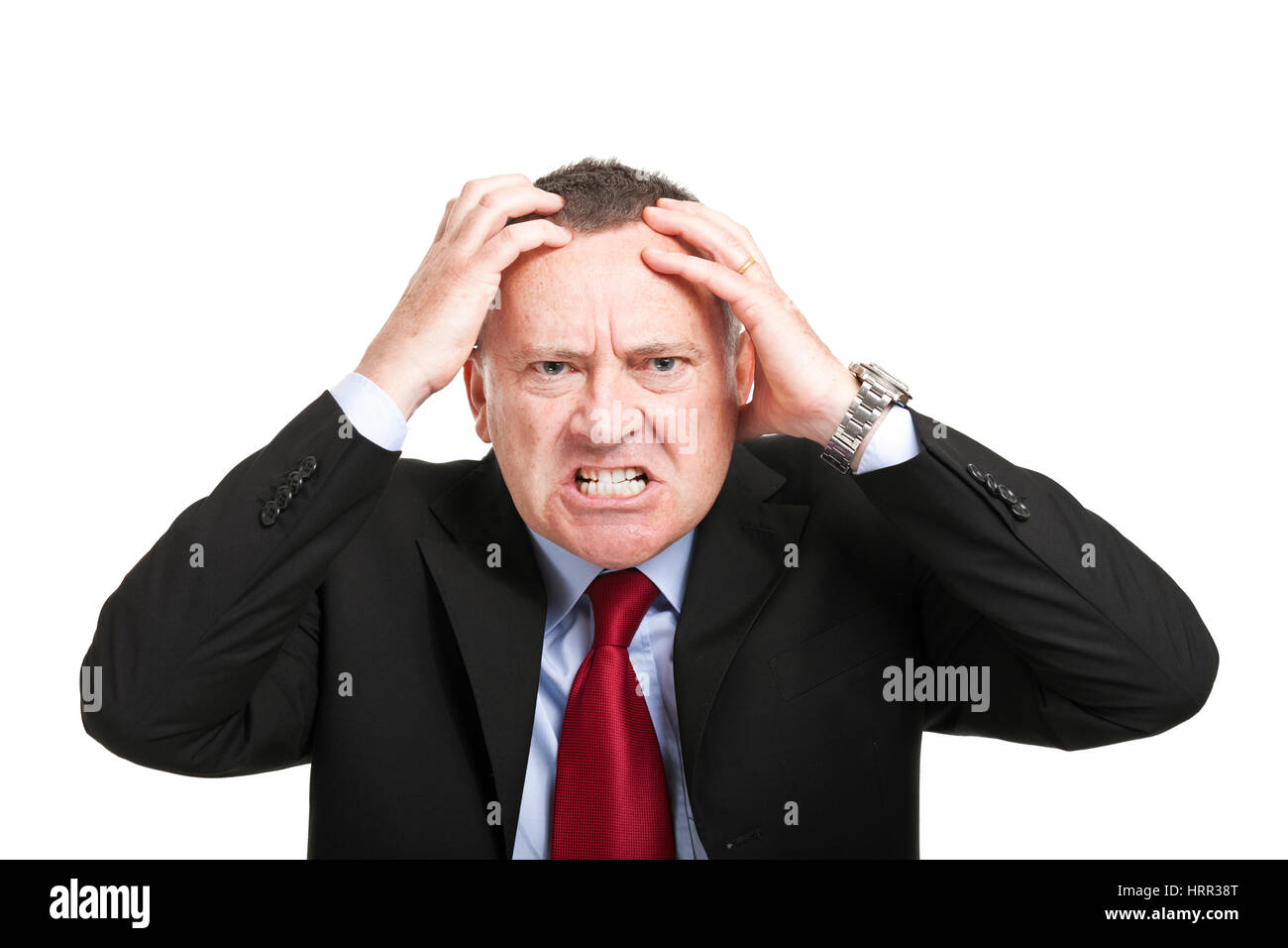 Wütend Geschäftsmann mit Händen in sein Haar, isoliert auf weiss Stockfoto