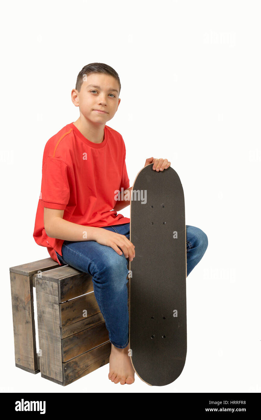 Kaukasische junge Teenager mit seinem skateboard Stockfoto